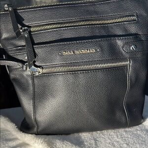 Black Crossbody Bag with Silver Zippers and Multiple Compartments